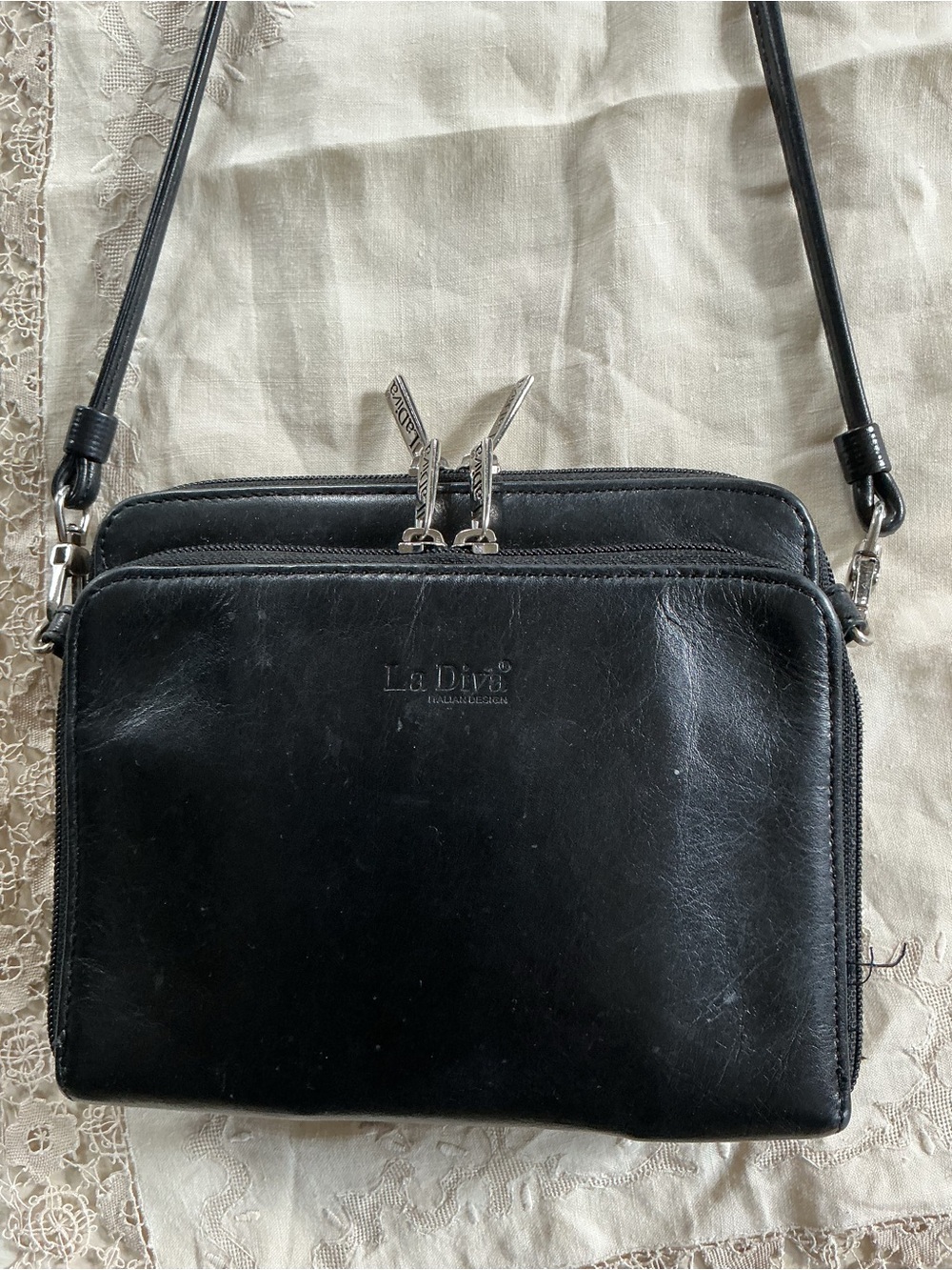 Sleek Black Leather Crossbody Bag with Front Zip Pocket
